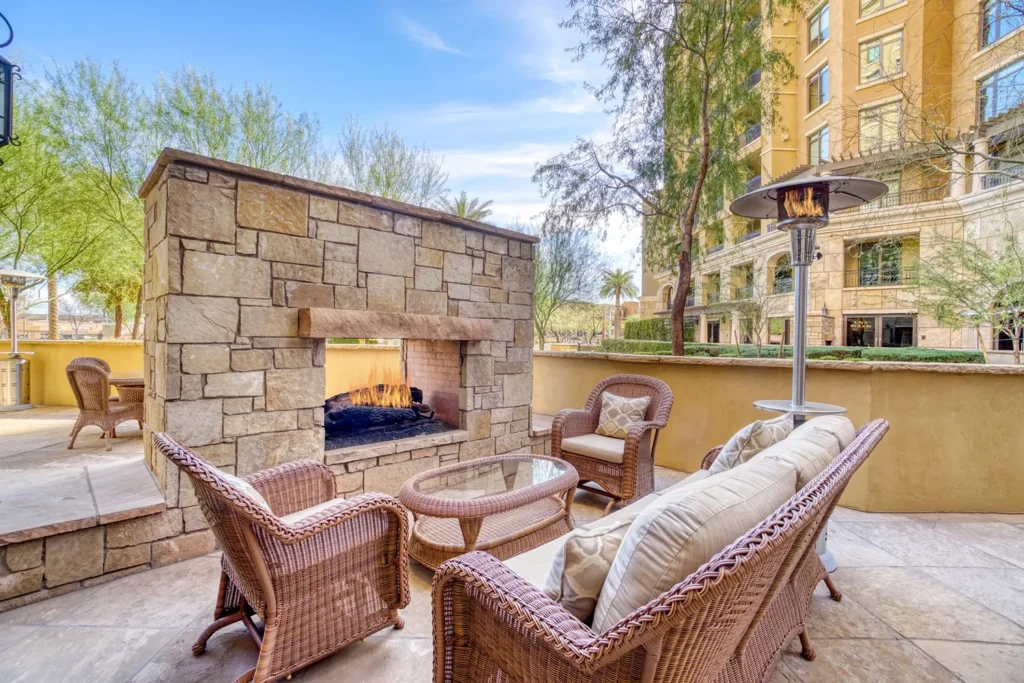 Outdoor firepit built into a wall.