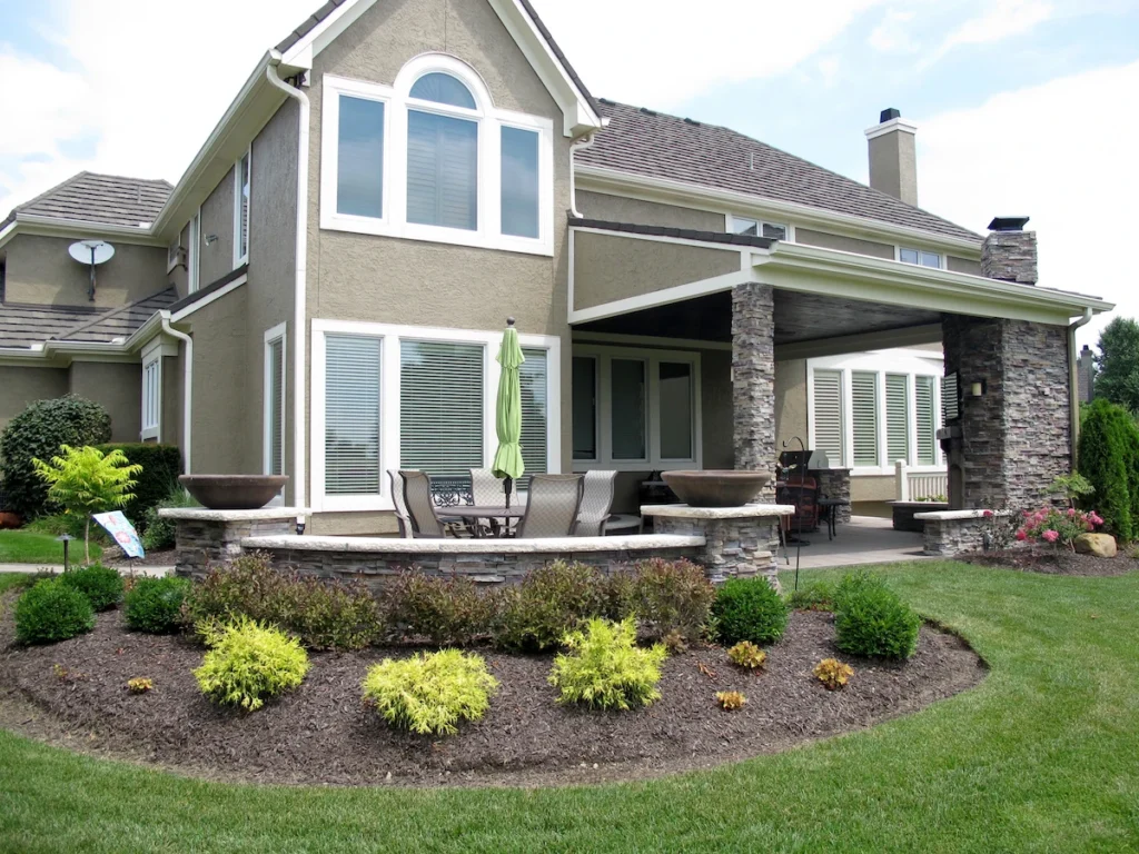 Well-maintained front yard with fresh mulch - curb appeal tips for selling homes in Johnson County Kansas