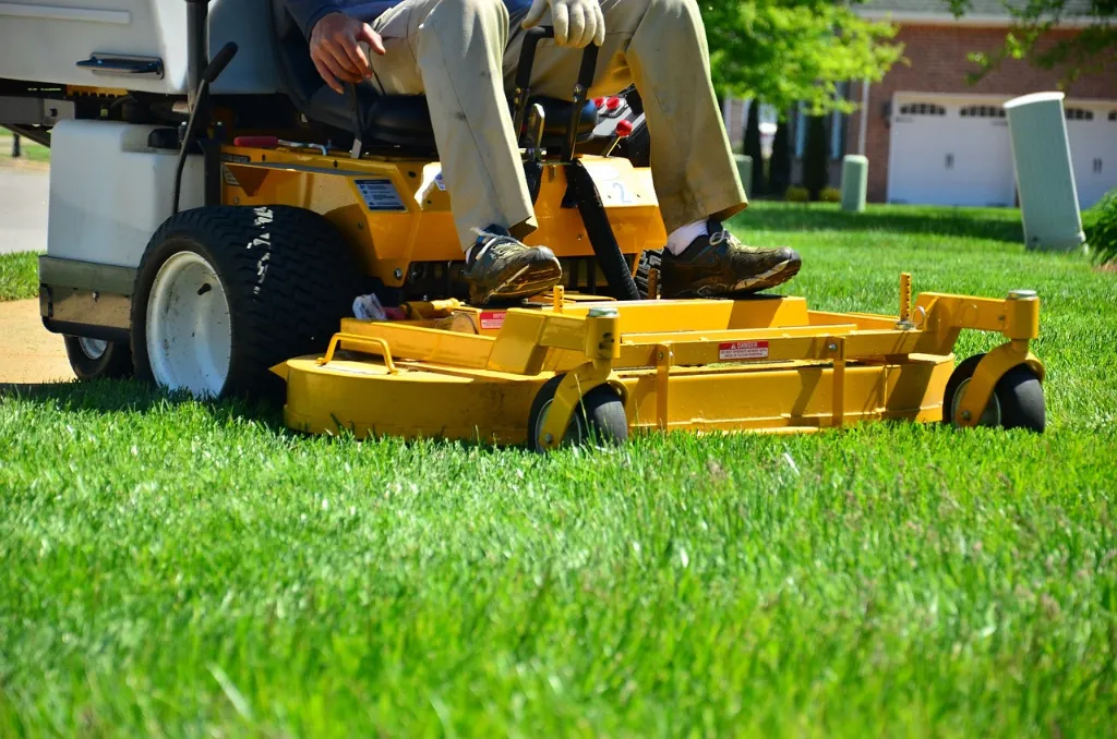 A large lawnmower on a green lawn.