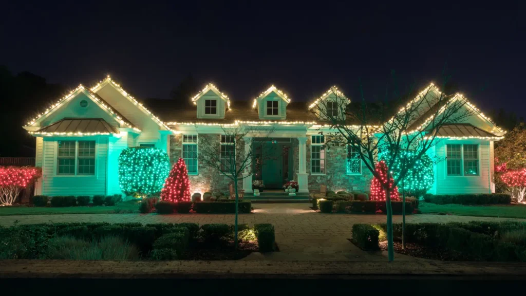 A house with red and green christmas lights.